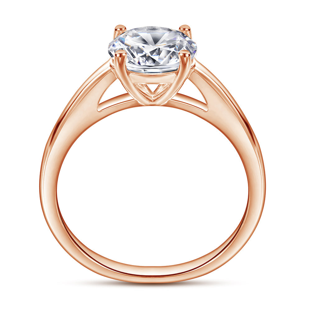 Rose gold ring with a large diamond on a white background