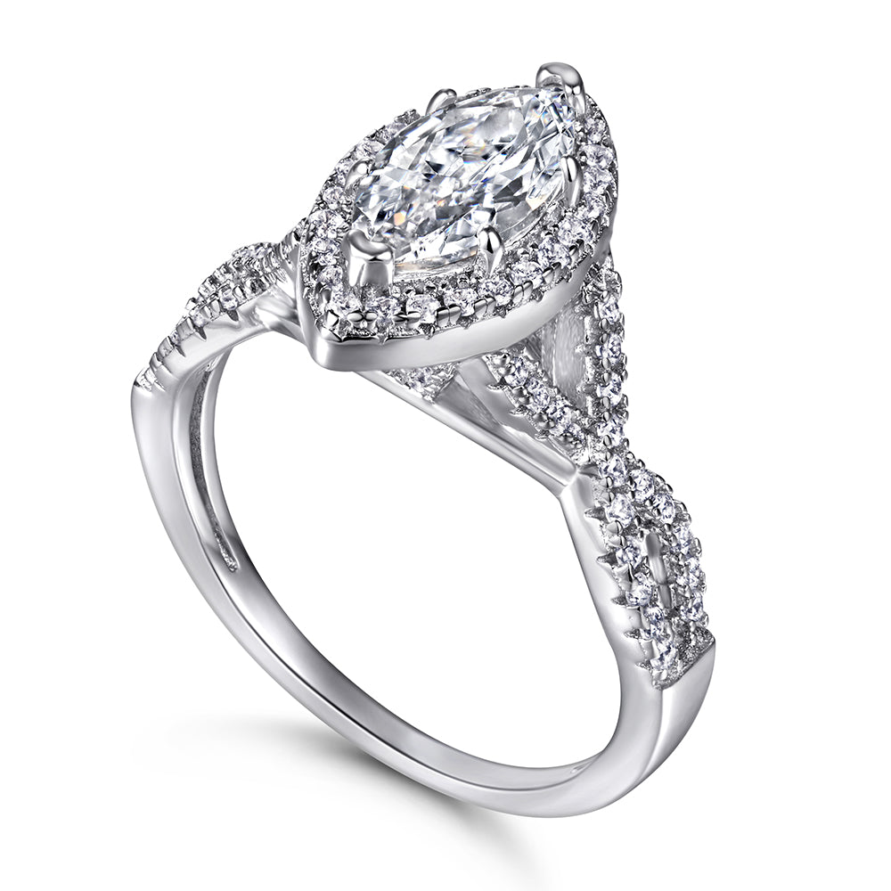 Diamond ring with a pear-shaped center stone on a white background