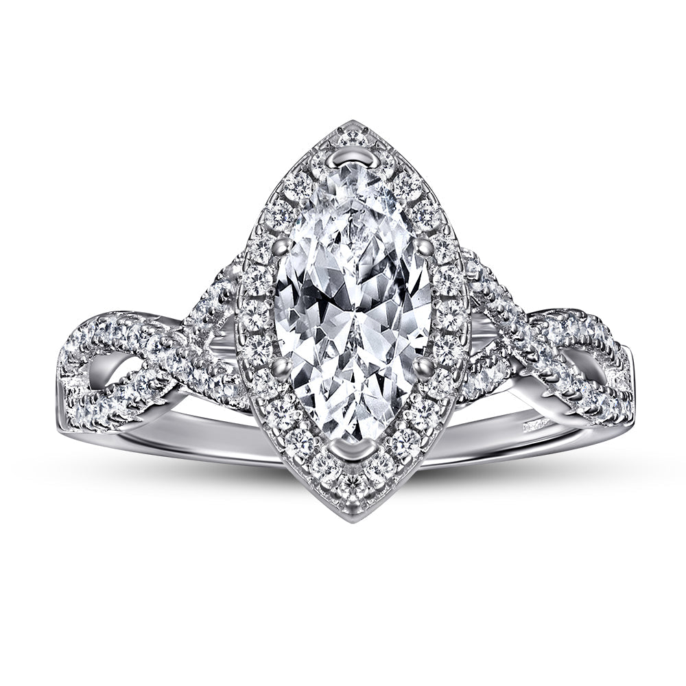 Diamond ring with a pear-shaped center stone on a white background