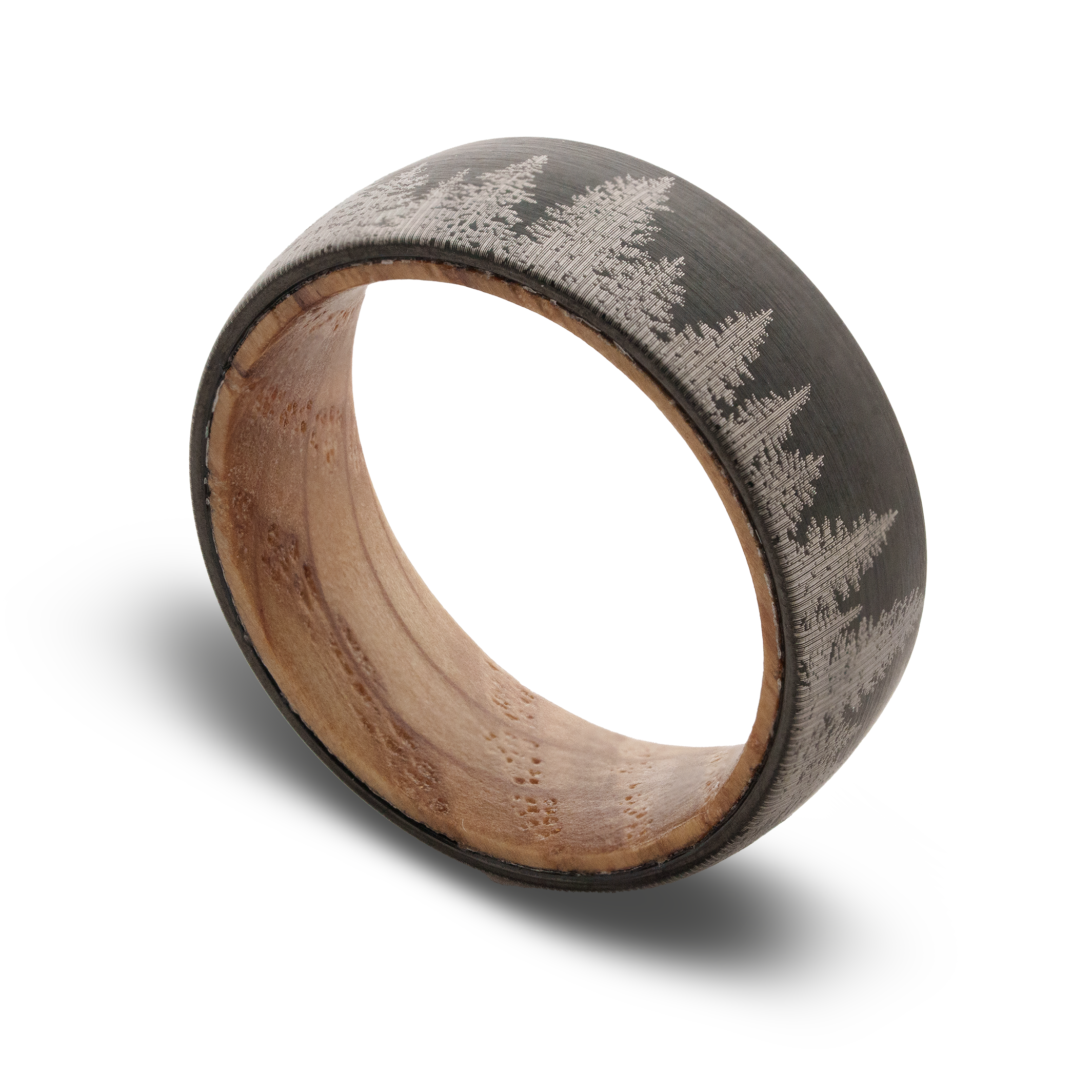 Wooden ring with engraved tree pattern on a white background