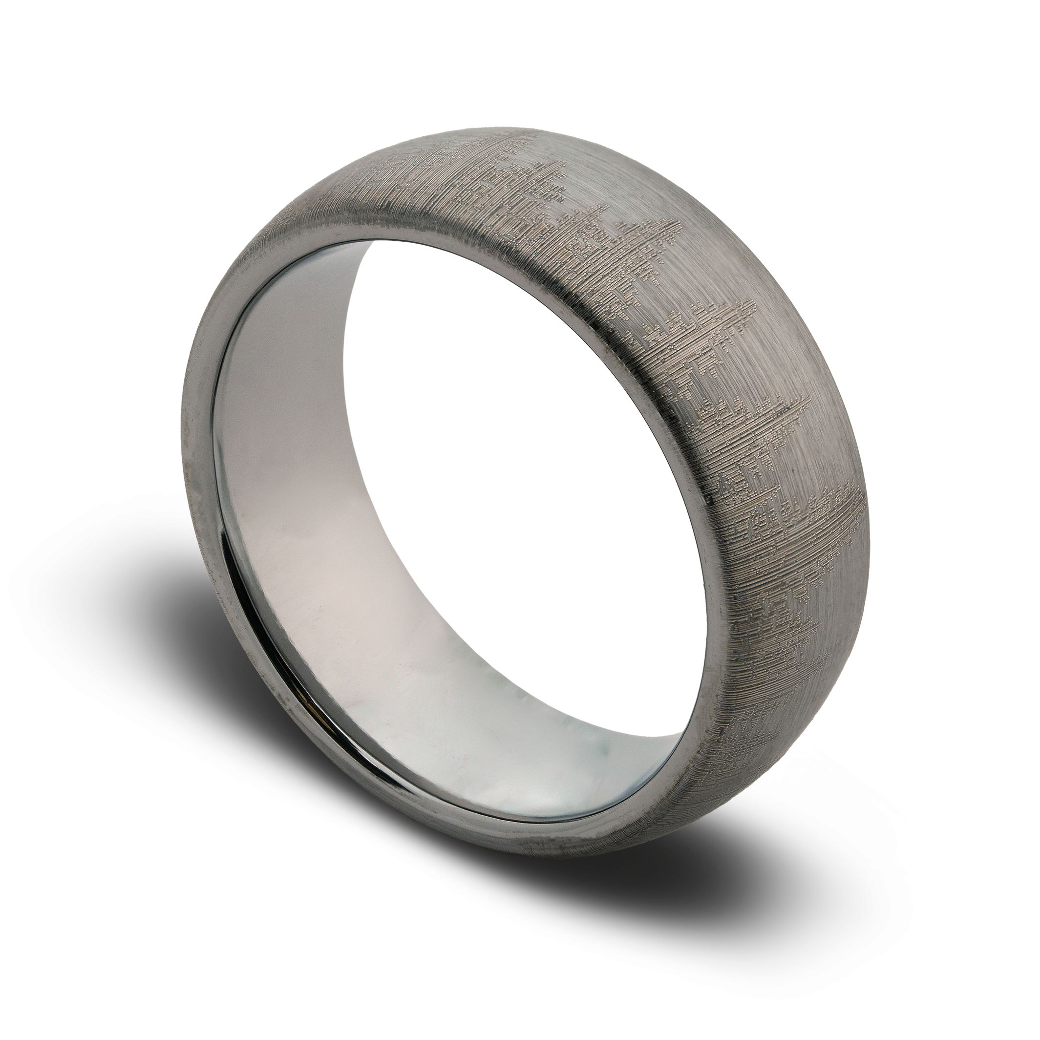 Silver ring with a textured surface on a white background