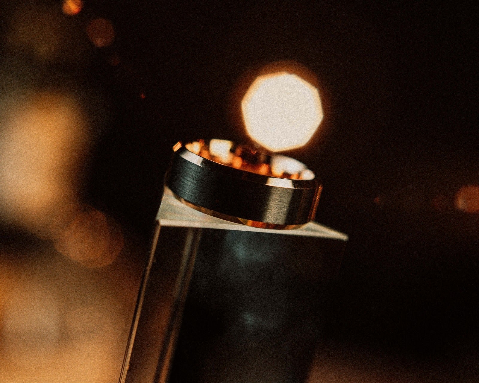 Close-up of a lit candle with a blurred background