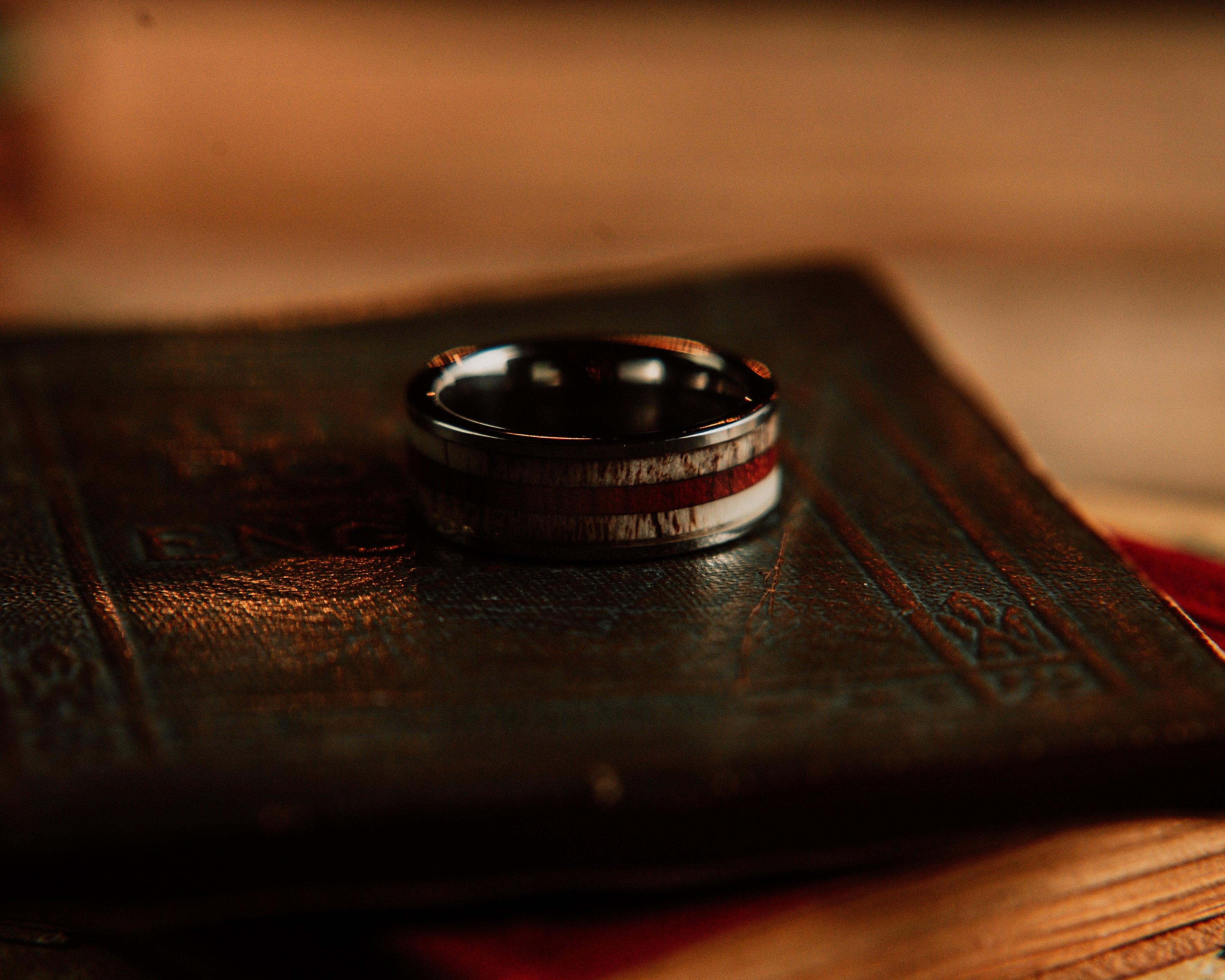 Ring on a leather surface with a blurred background
