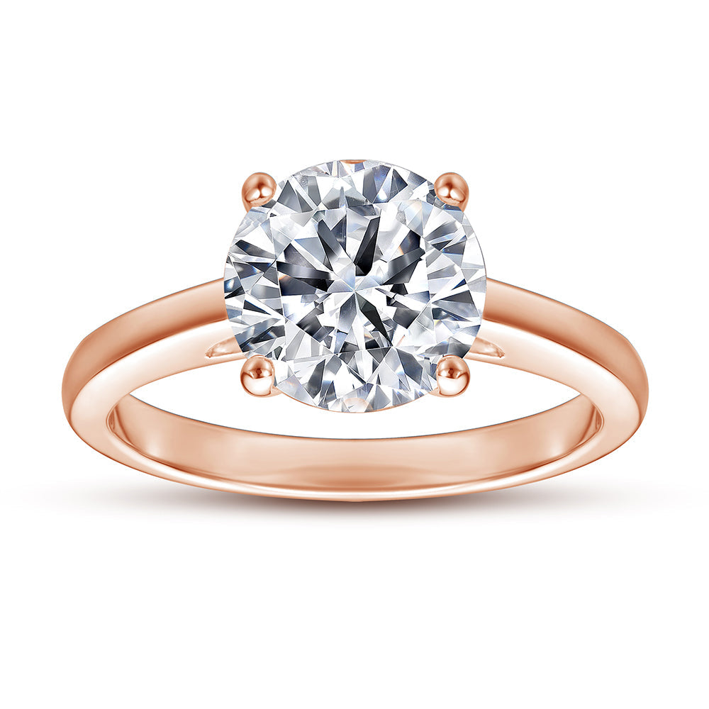 Rose gold ring with a large diamond on a white background