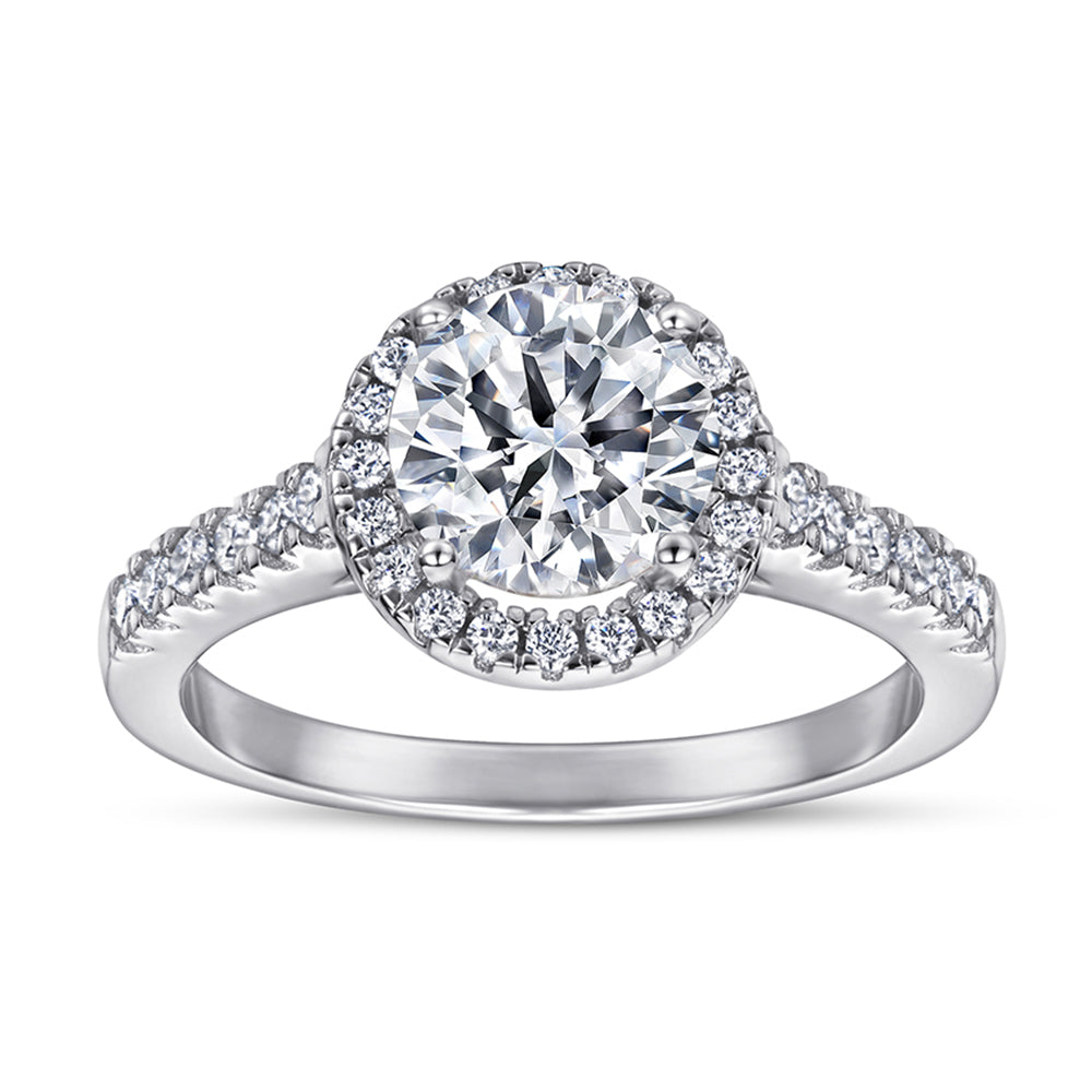 Diamond ring with a halo and intricate design on a white background