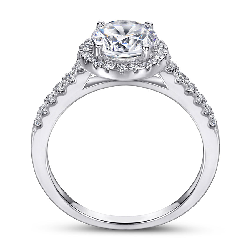Diamond ring with a clear gemstone and smaller diamonds on a white background