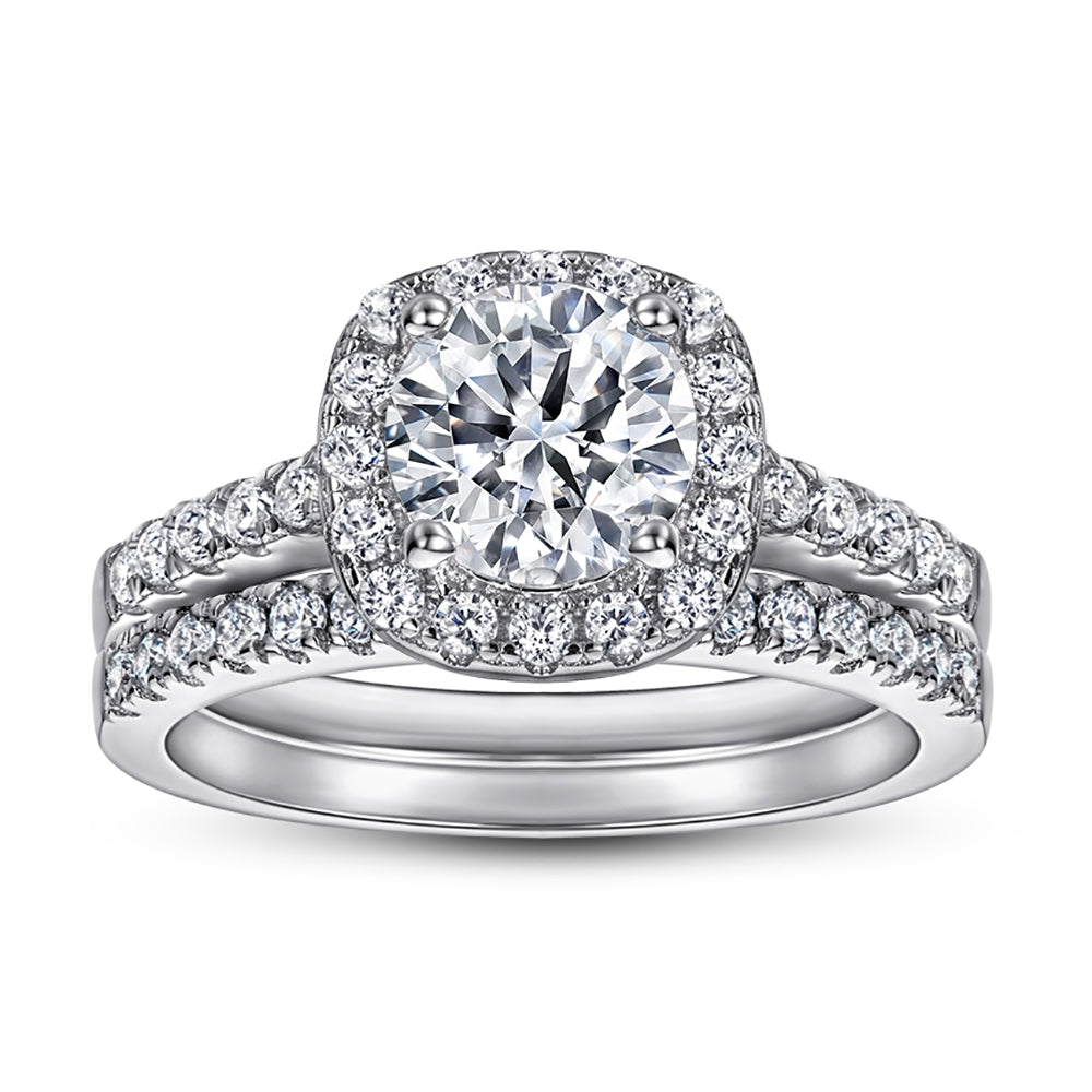 Diamond ring with a halo and intricate design on a white background