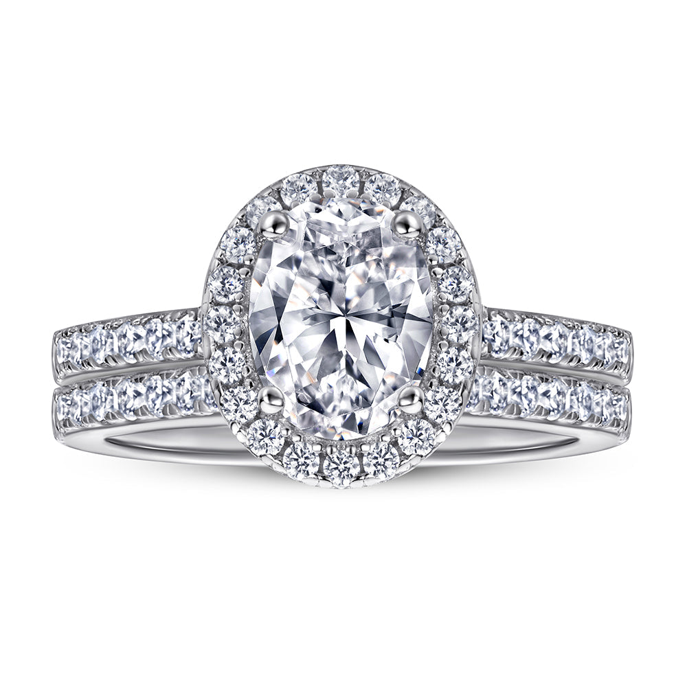 Diamond ring with a pear-shaped center stone on a white background