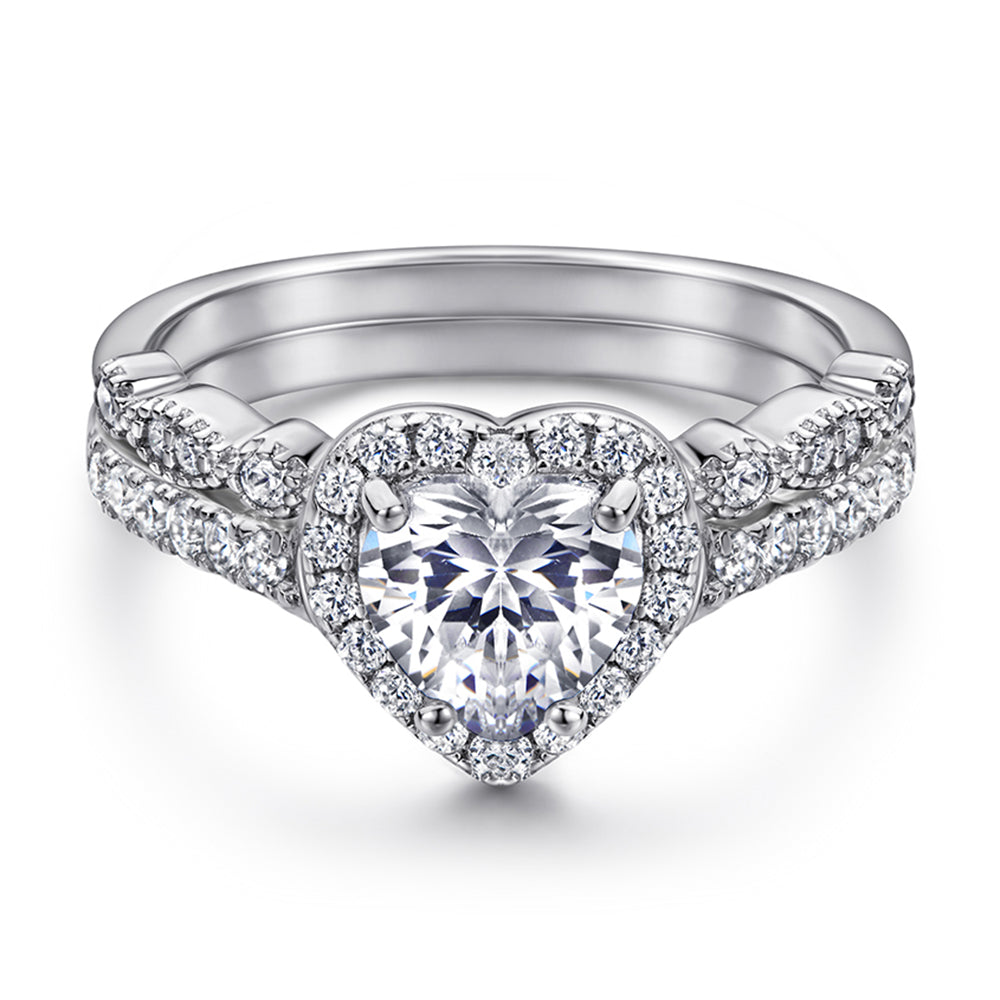 Silver heart-shaped diamond ring on a white background