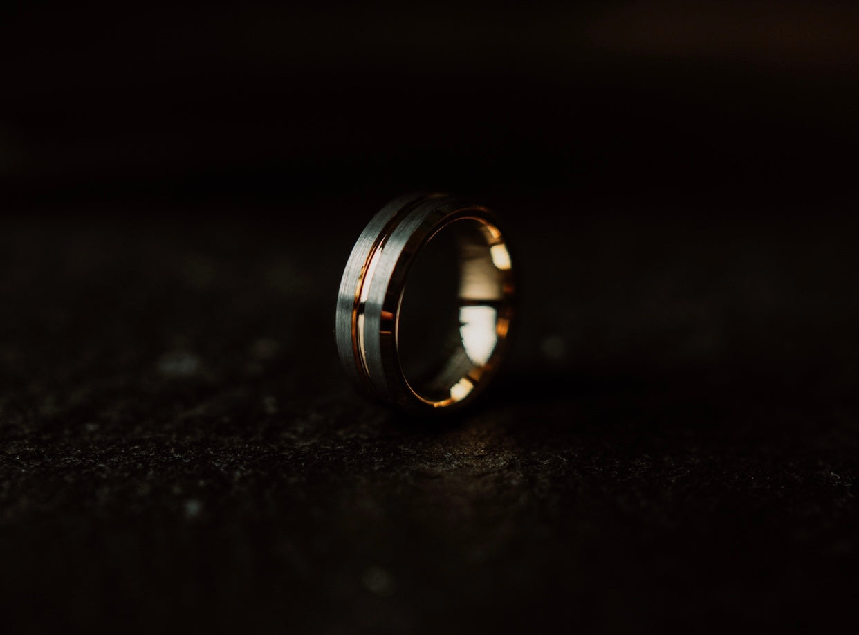 Gold ring on a dark textured surface