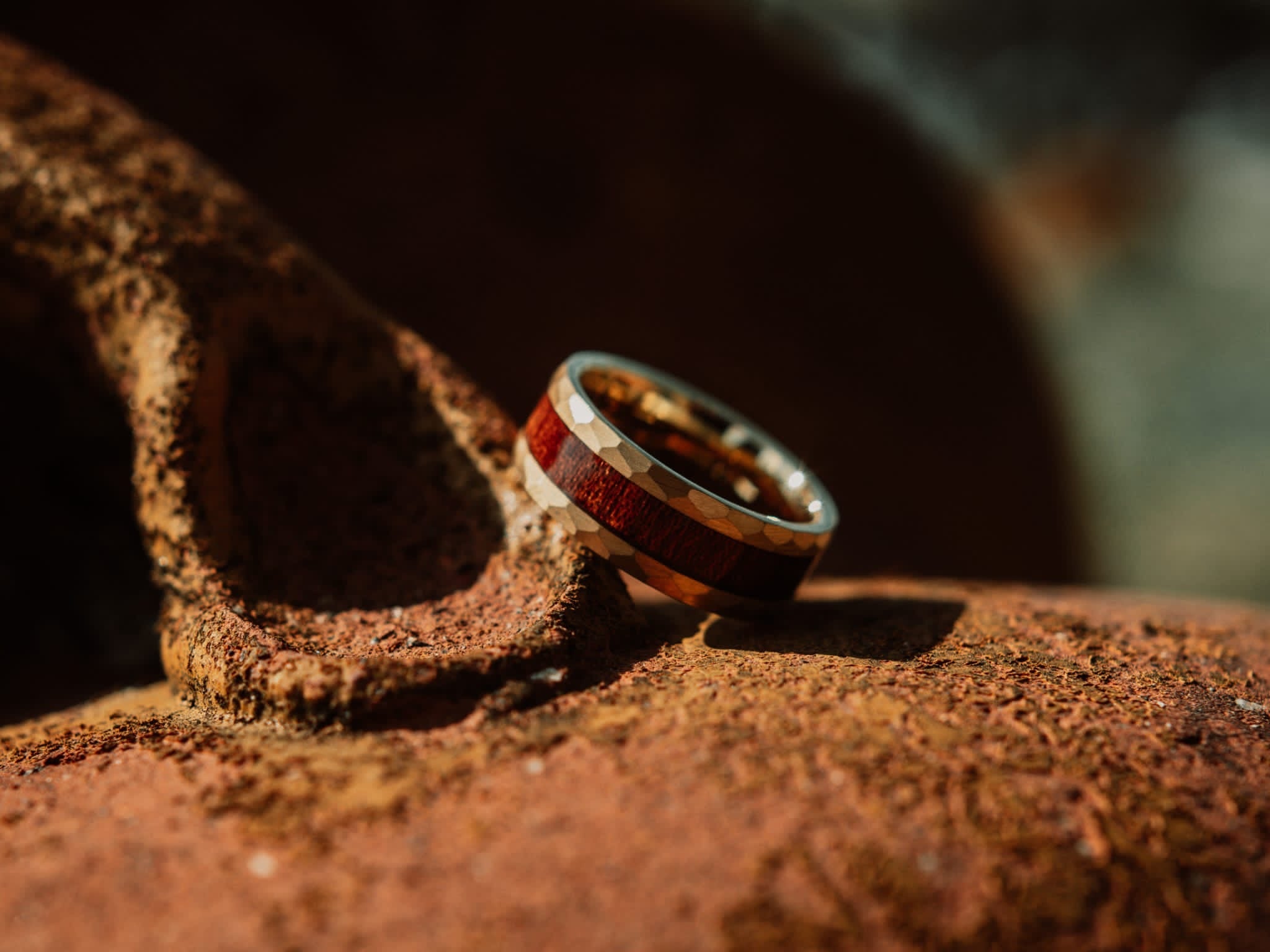 Wooden ring on a textured brown surface with a blurred background